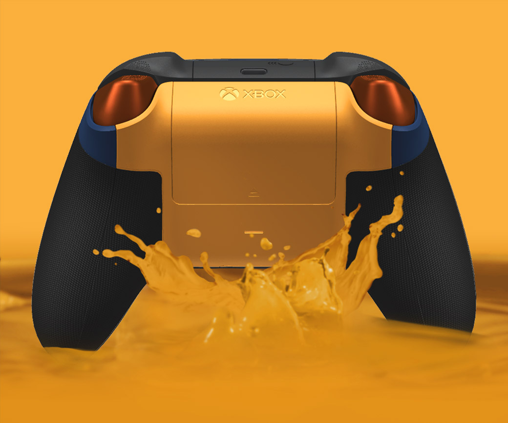 Back view of a black and soft orange controller along with soft orange liquid splash below.